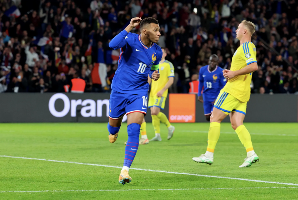 Kylian Mbappe celebrating after scoring for France during an international football match